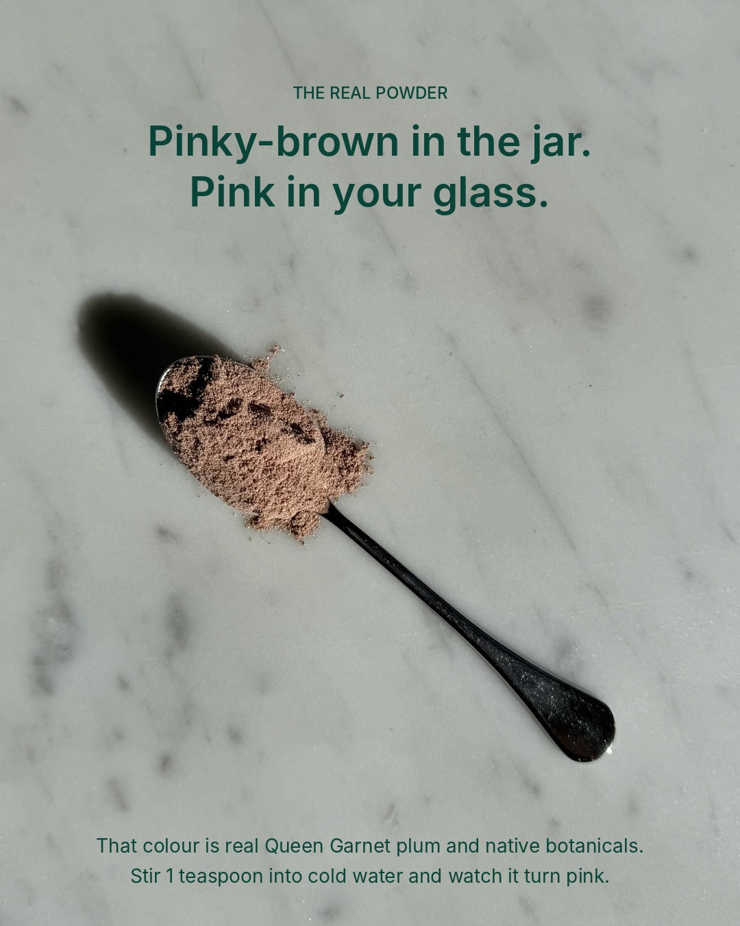 Unedited photo of Gut Ritual+ powder on a spoon: pinky-brown in the jar, turns pink in water